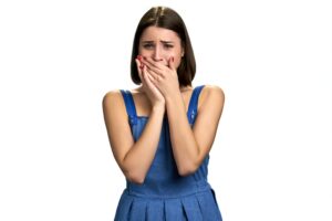 girl crying with hands covering mouth 2021 11 11 02 15 49 utc