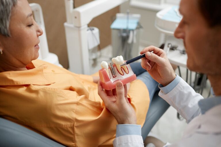 closeup of male dentist explaining dental implant 2023 06 07 17 20 22 utc
