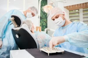 male dentist using dental implant kit in dental of 2022 05 30 22 51 01 utc