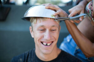 woman cutting young man s hair using bowl man s t 2022 03 04 01 51 30 utc